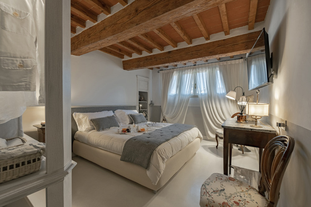 Elegant bedroom with classic furniture and warm tones