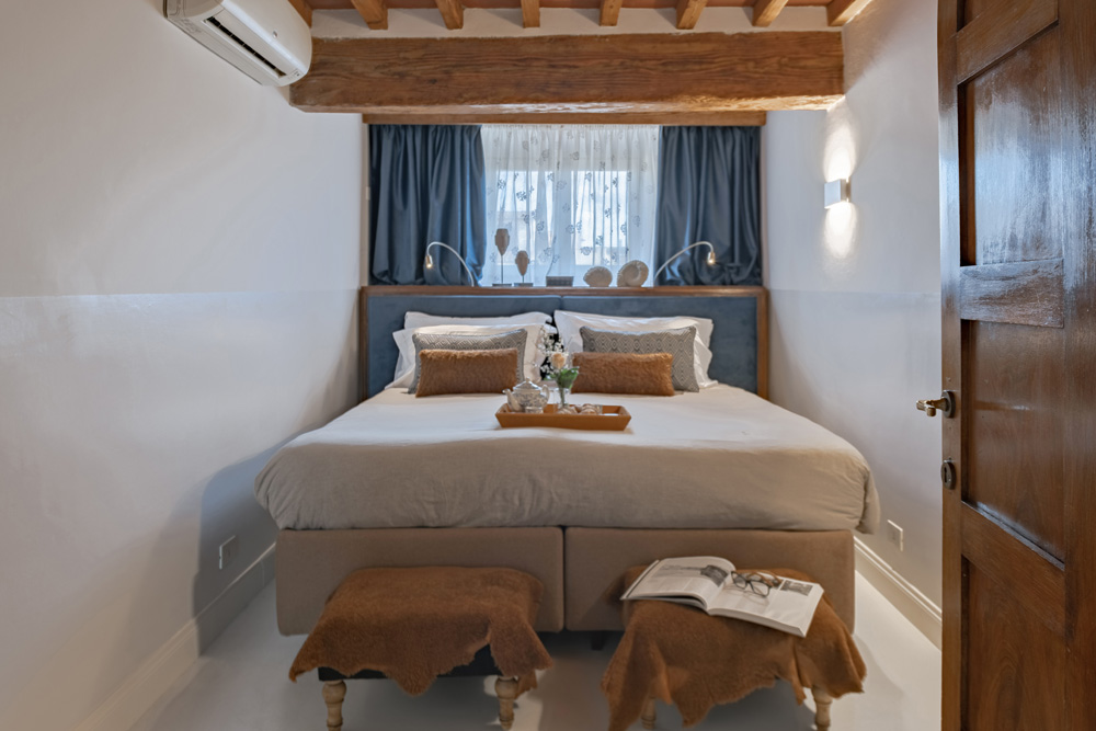 Bright bedroom with natural light and refined decor