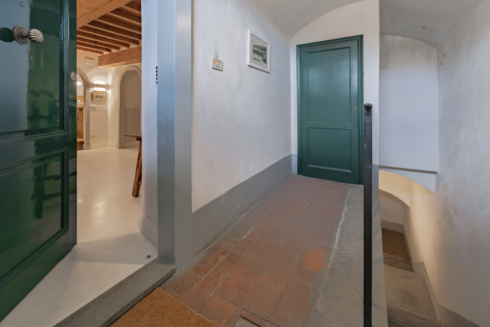 Elegant entrance corridor with classic flooring in Florence apartment