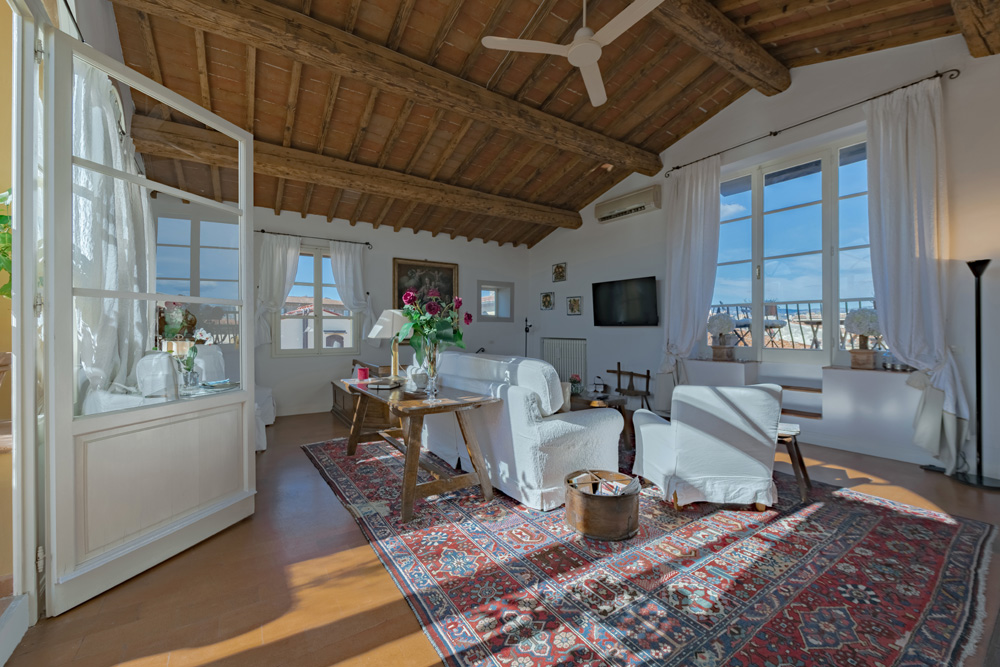 Panoramic living area with large windows and natural light