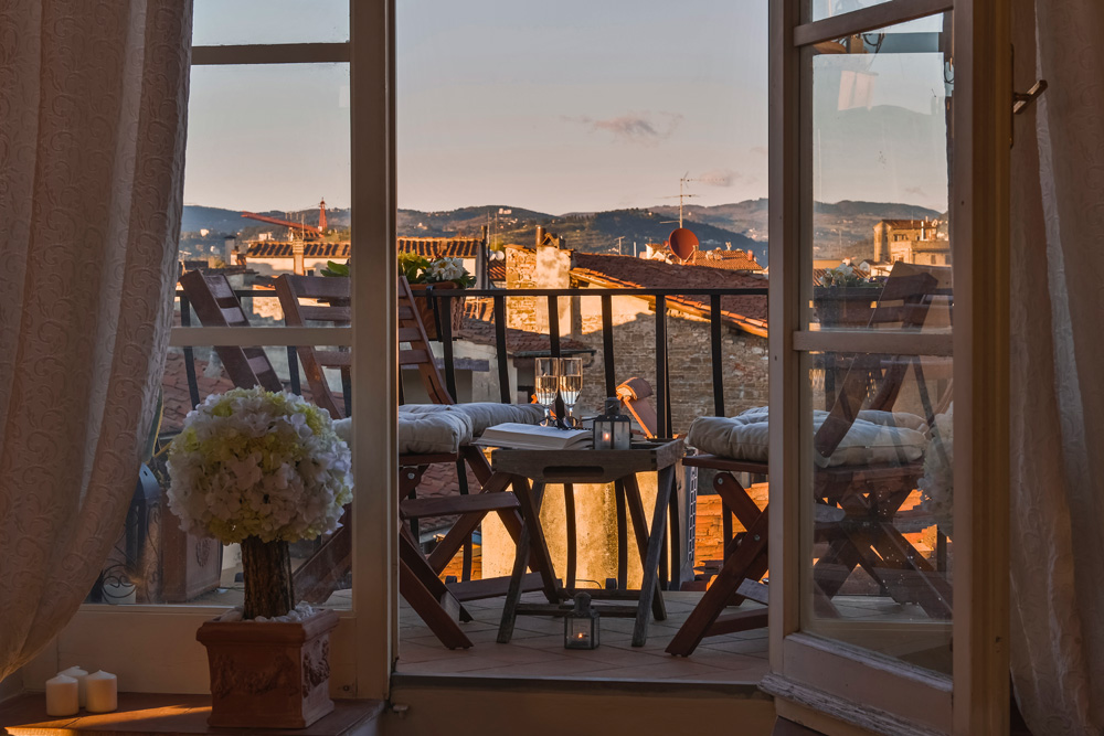 Terrace dining area overlooking Florence at sunset