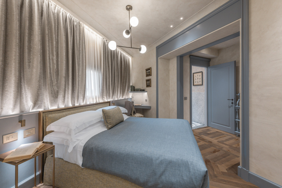 Classic bedroom with elegant decor in Florence historical apartment