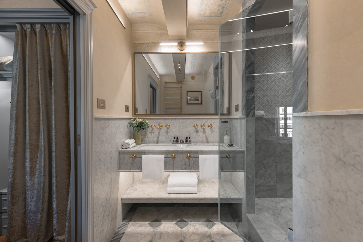 Bedroom connected to corridor in Florence historic apartment