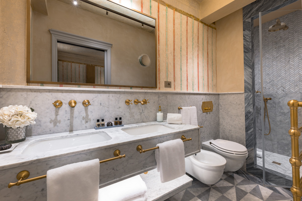 Elegant bedroom with soft lighting in Florence historic home