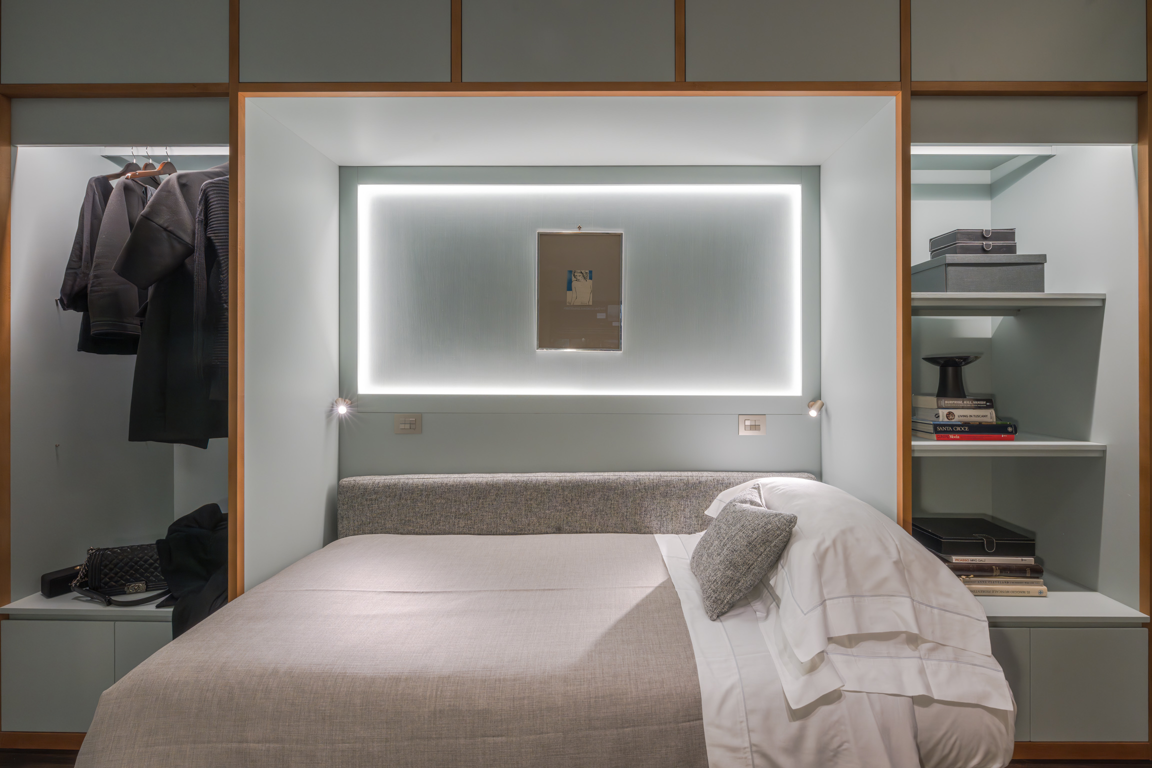 Bedroom with modern lighting in Florence apartment