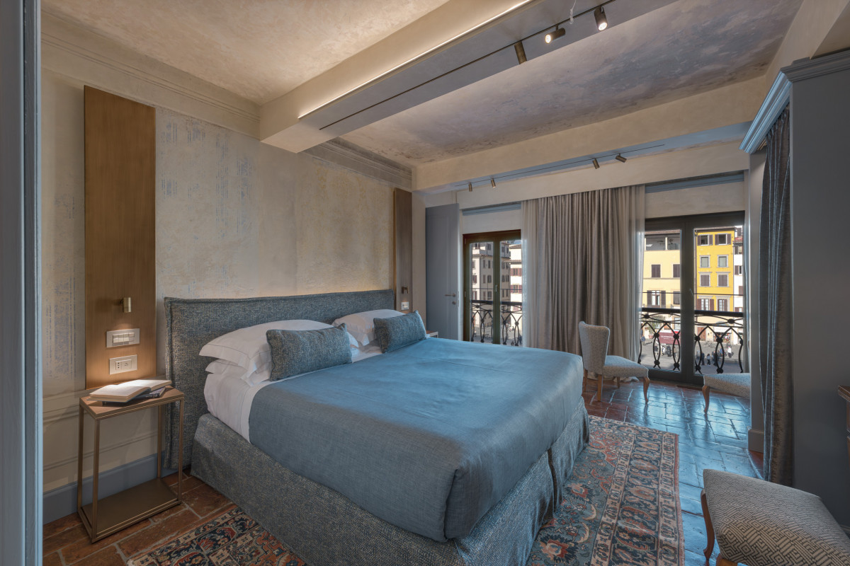 Bedroom with window view in Florence historic apartment