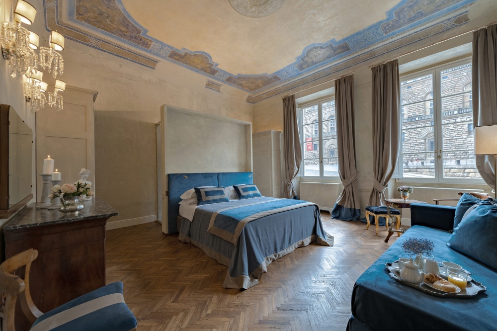 Blue luxury bedroom suite in historic apartment in Florence