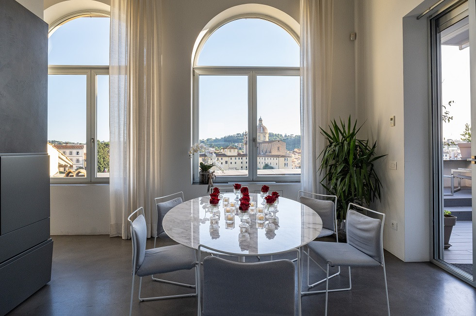 Dining area with large window and Florence view