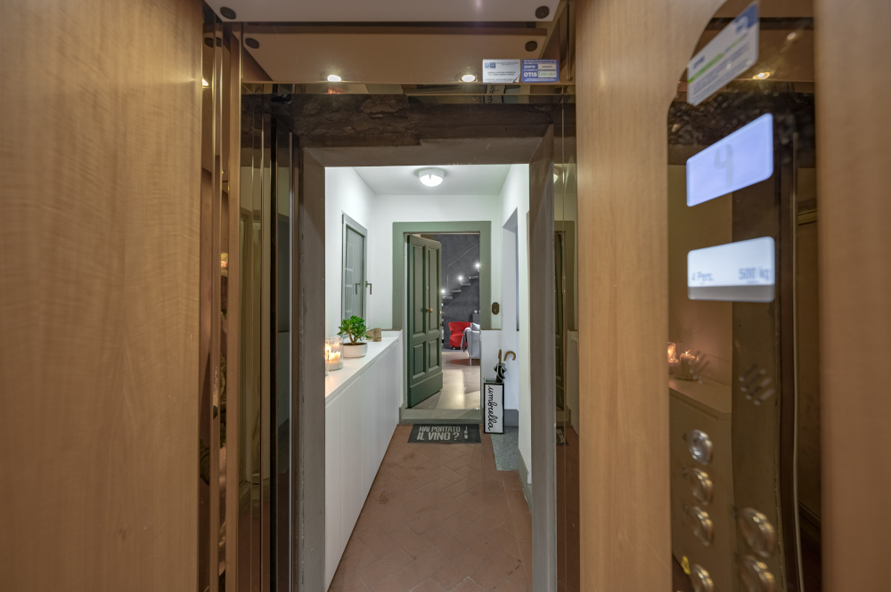 Modern entrance corridor with warm lighting in Casamanda penthouse