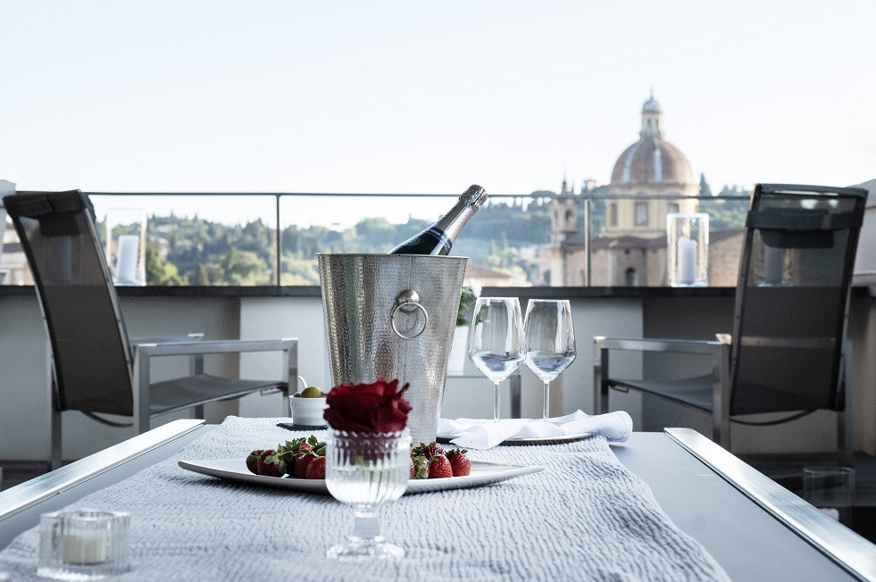 Breakfast setup on terrace with city view