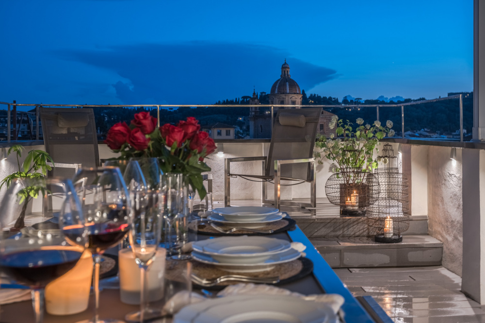 Terrace dining area with Florence view at night