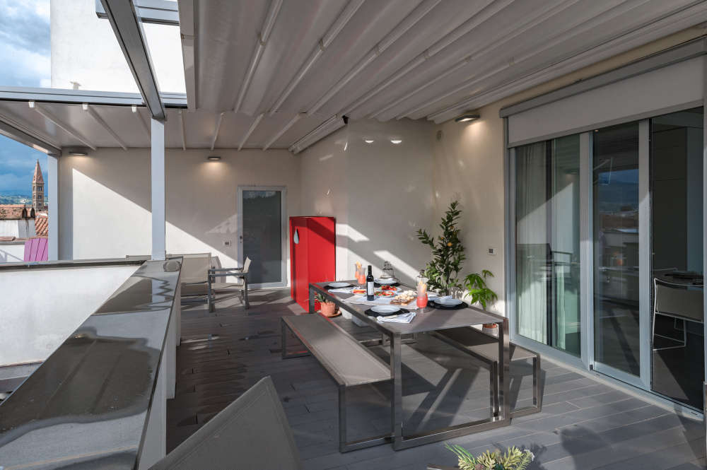 Modern terrace with outdoor furniture and city view