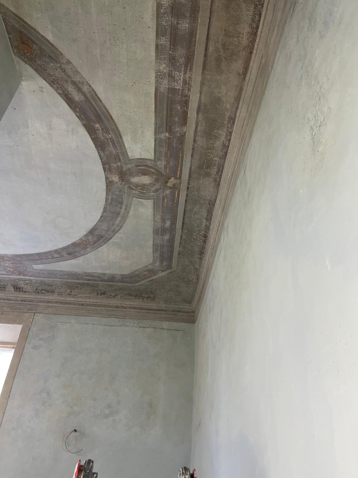Ceiling restoration progress in historic apartment in Florence