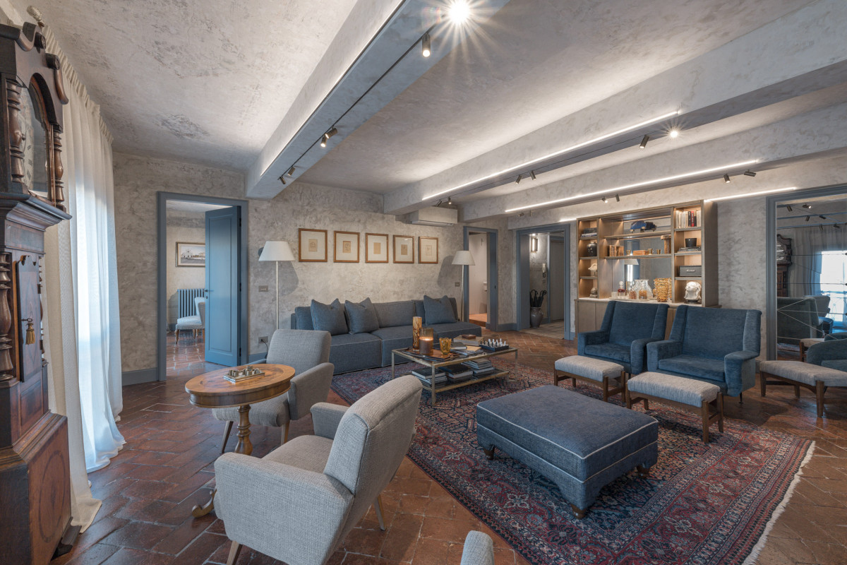 Classic living room with elegant furnishings in Florence historic apartment