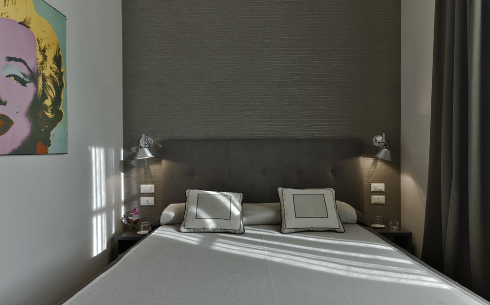 modern dark style bedroom in Florence apartment