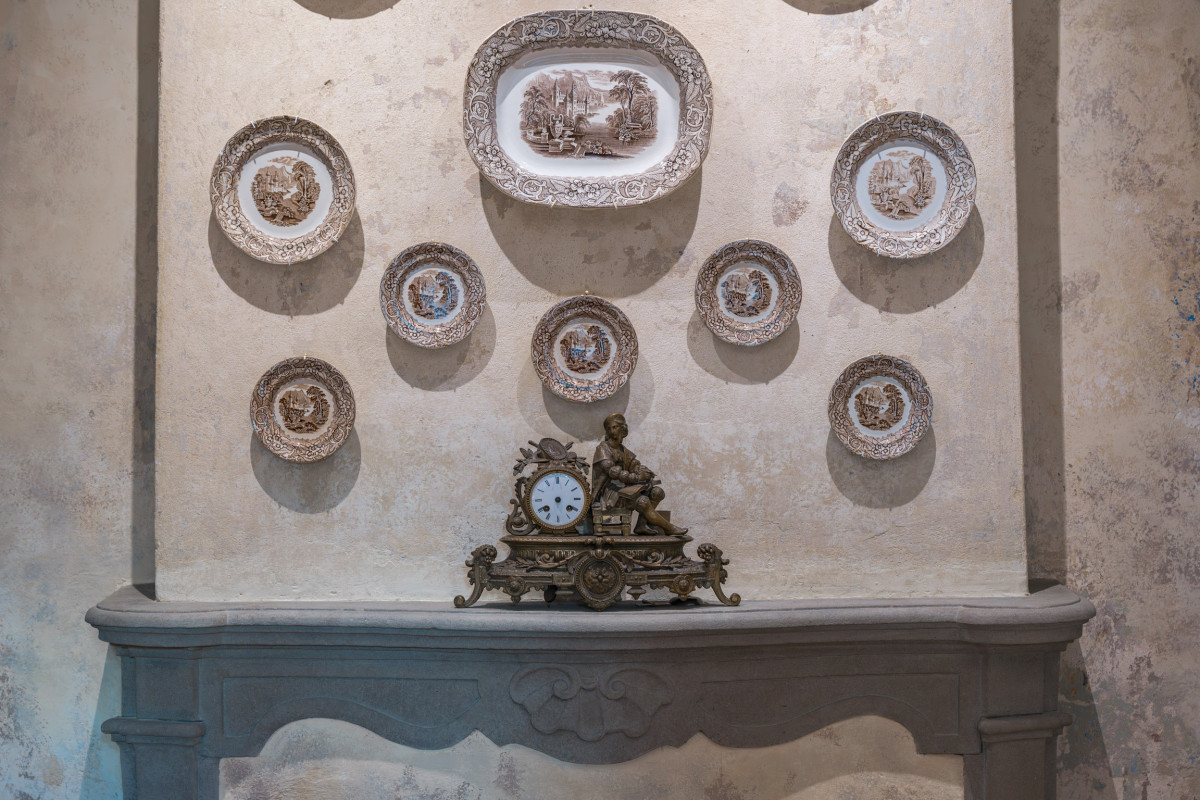Decorative plates wall in historic Florence apartment