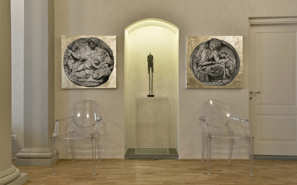 decorative wall with artwork in Florence apartment