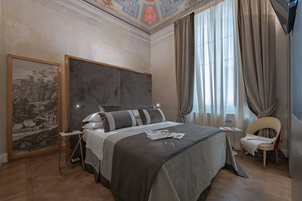 Double bedroom with warm copper tones in Florence luxury apartment