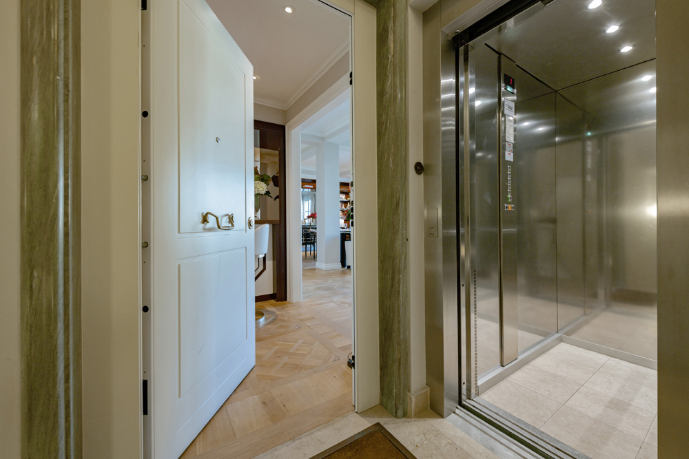 Elevator and entrance door of Unicko luxury apartment in Florence