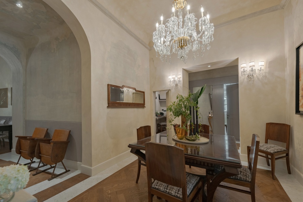 Elegant entrance hall with chandelier in Pitti Historical Home