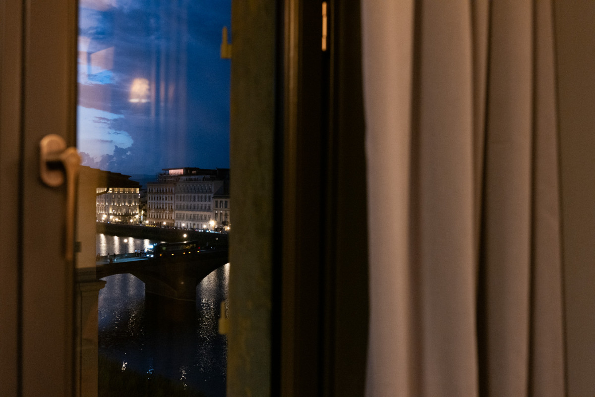 View of the Arno river from a luxury apartment in Florence at night