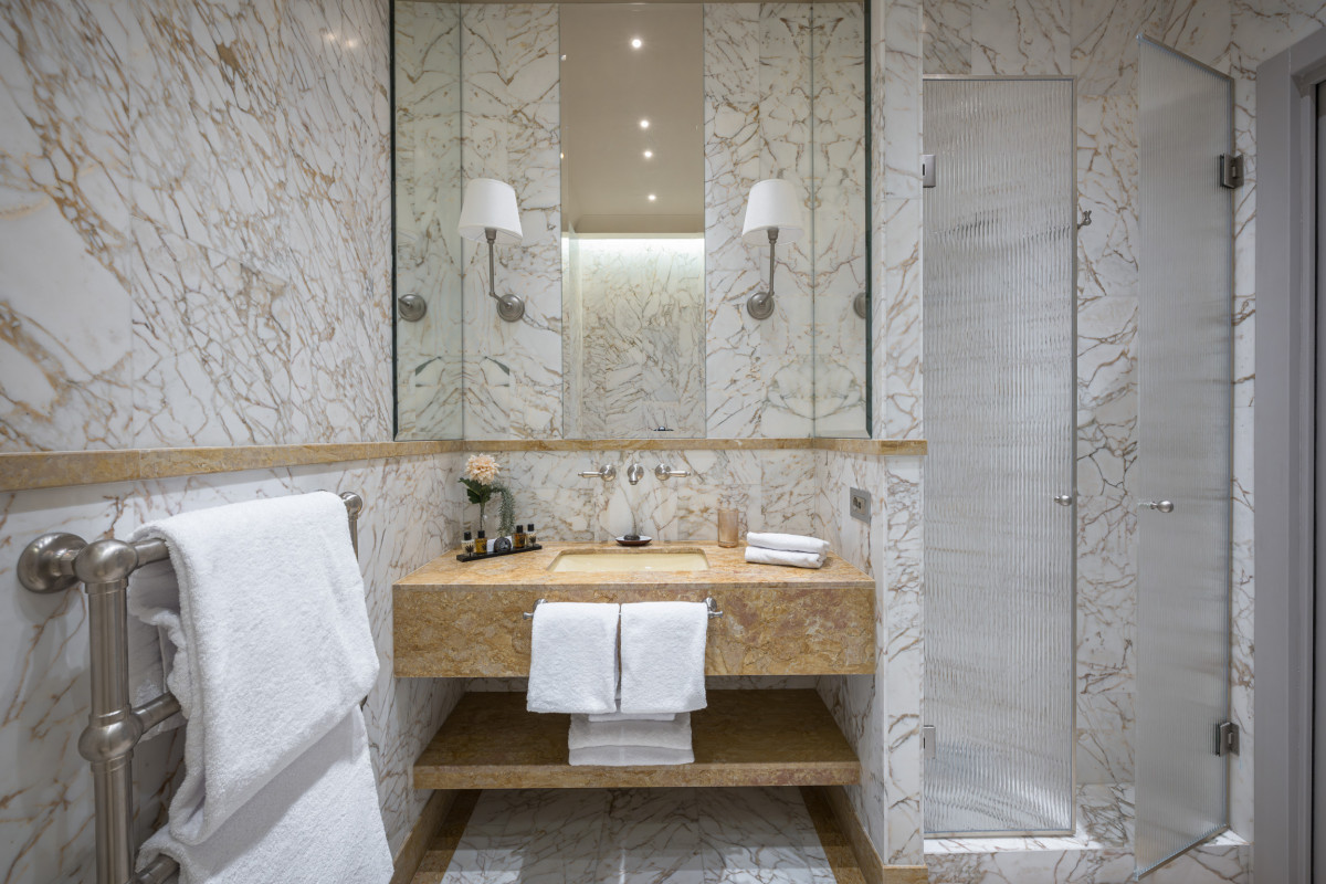 Bathroom detail with marble finishes in Florence apartment