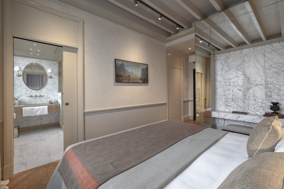 Bedroom with marble bathroom in Florence apartment