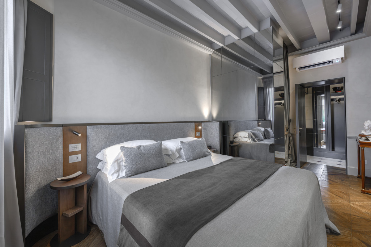 Elegant bedroom interior in Florence luxury apartment