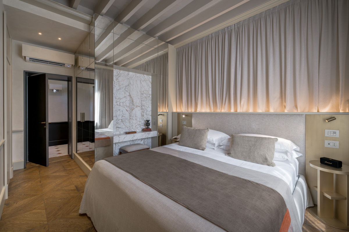 Bedroom in Florence apartment with window view