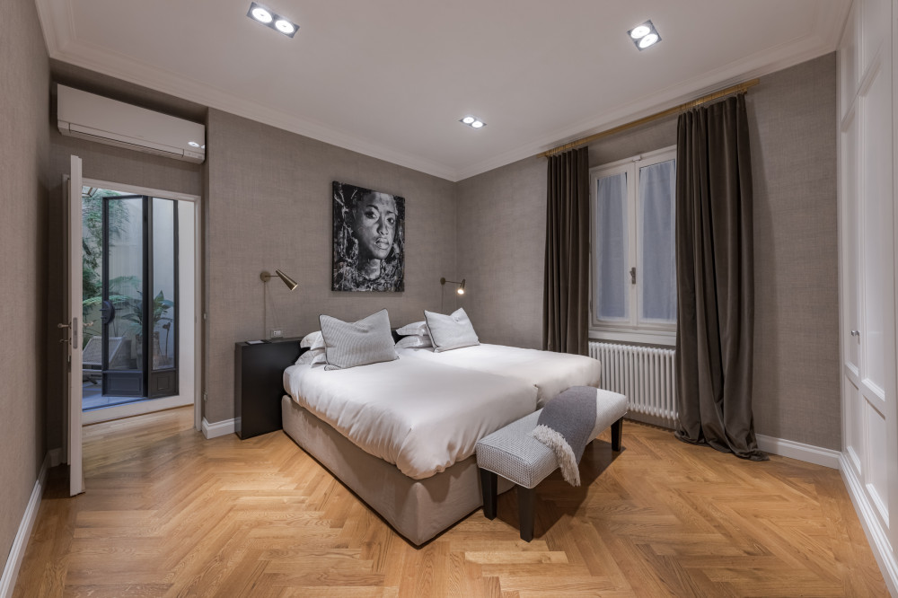 Bedroom in Florence apartment with balcony door