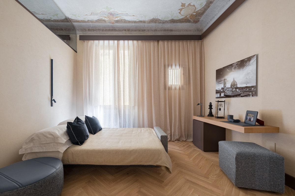 Bedroom with window in Florence apartment