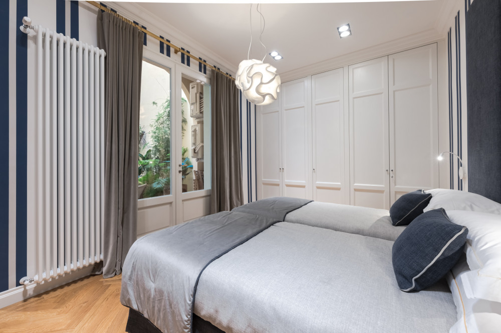 Bedroom in Florence apartment with window view