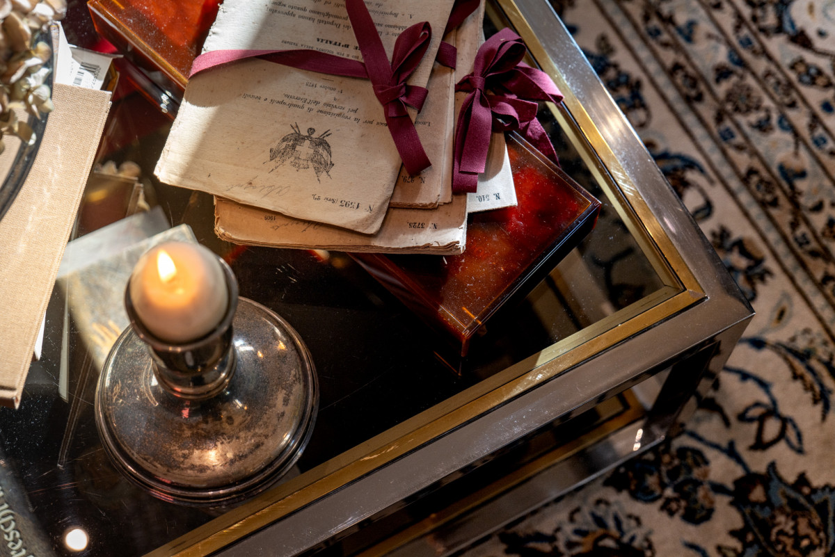 Books and candle detail in Florence apartment