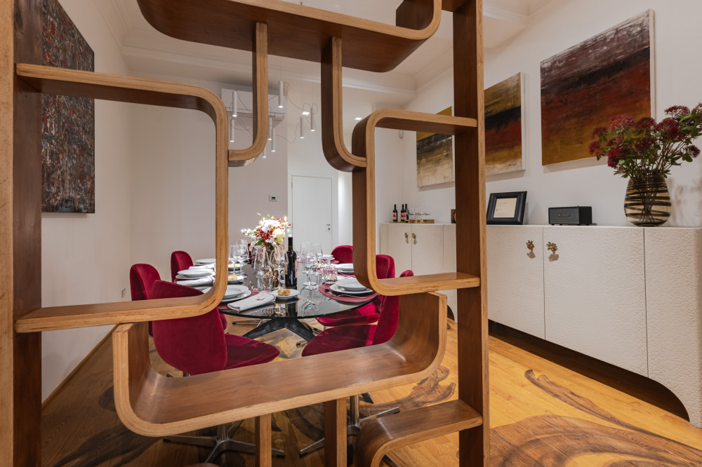 Dining room view through decorative divider in Florence apartment
