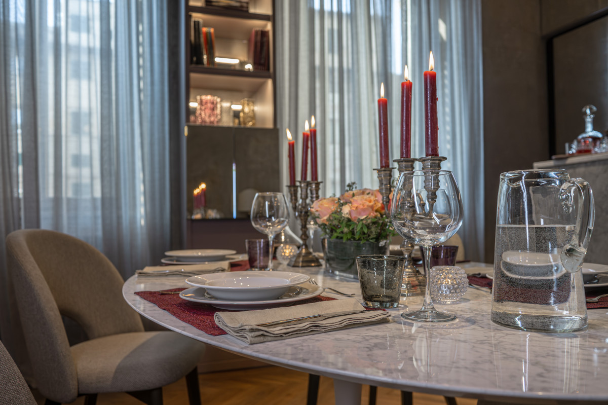 Elegant dining table in Florence apartment with refined decor