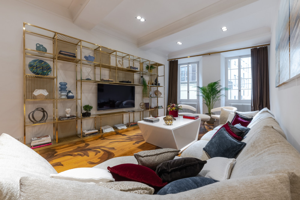 Living room in Florence apartment with sofa and TV area