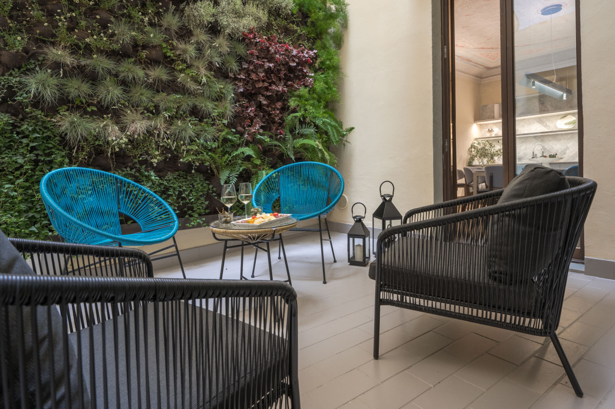 Patio seating area in Florence apartment