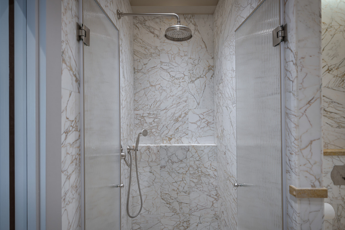Walk-in marble shower in Florence apartment