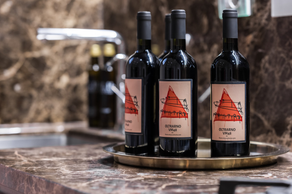 Wine bottles detail in Florence apartment