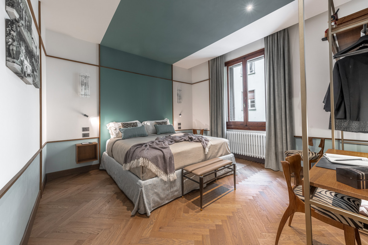 Bedroom with green tones and natural light