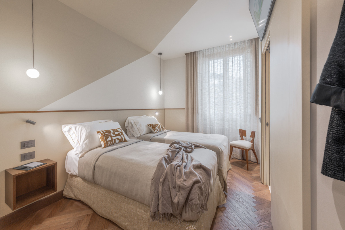 Master bedroom with double bed and neutral tones