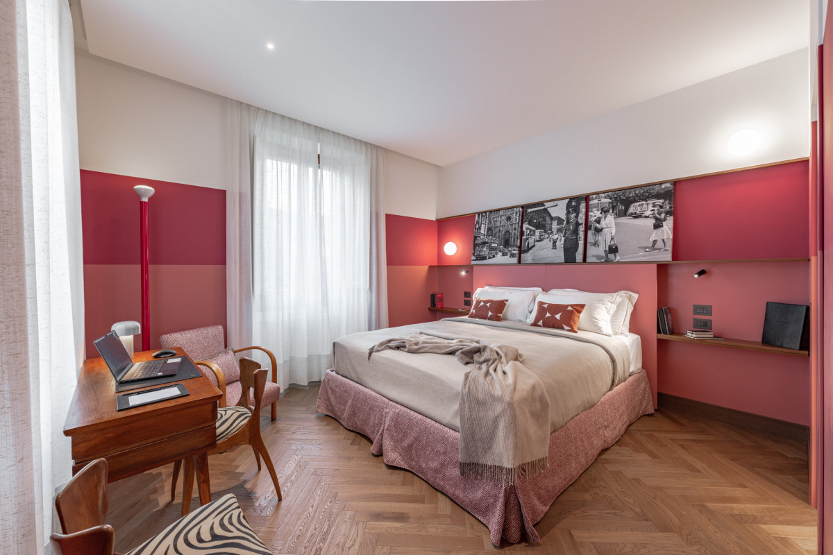 Bedroom with red wall and double bed