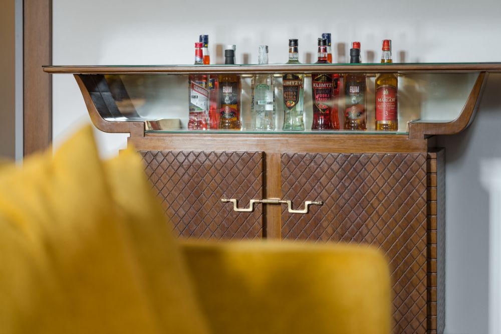 Detail of 1950s style furniture in the living area of the G9 Vasari View apartment