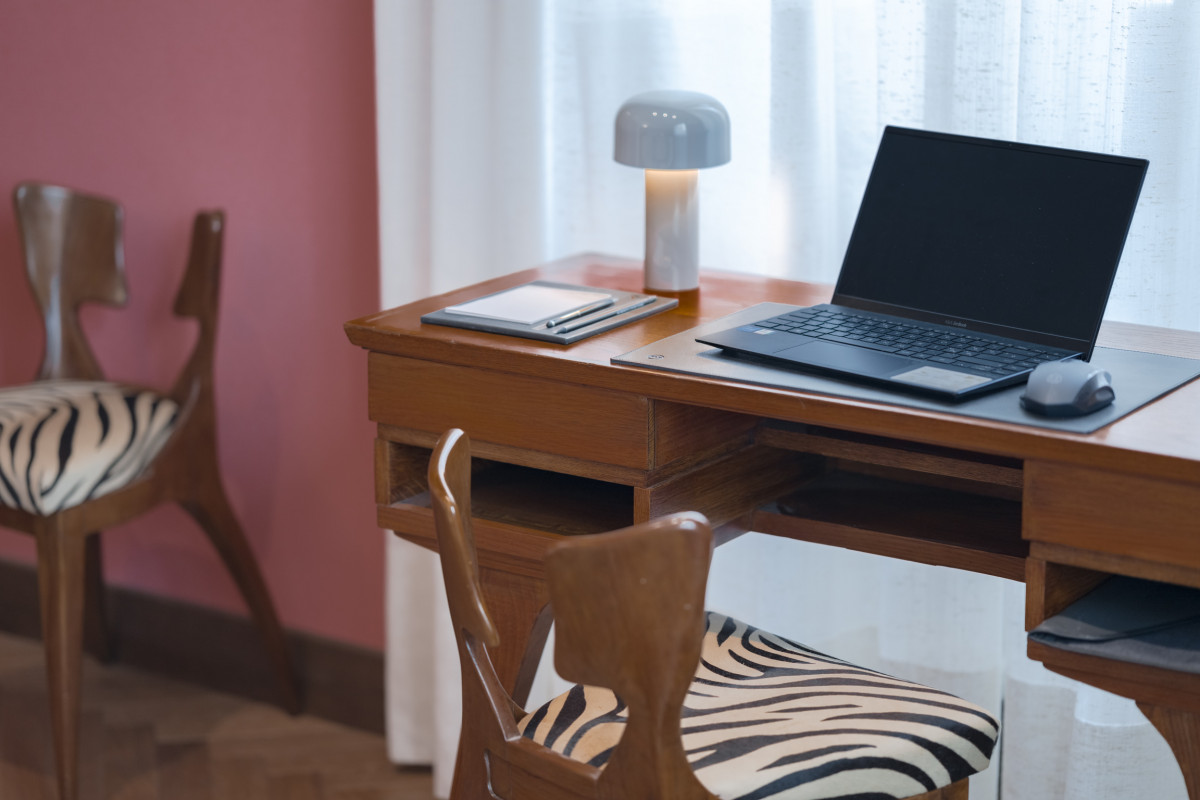Small home office area with desk and laptop