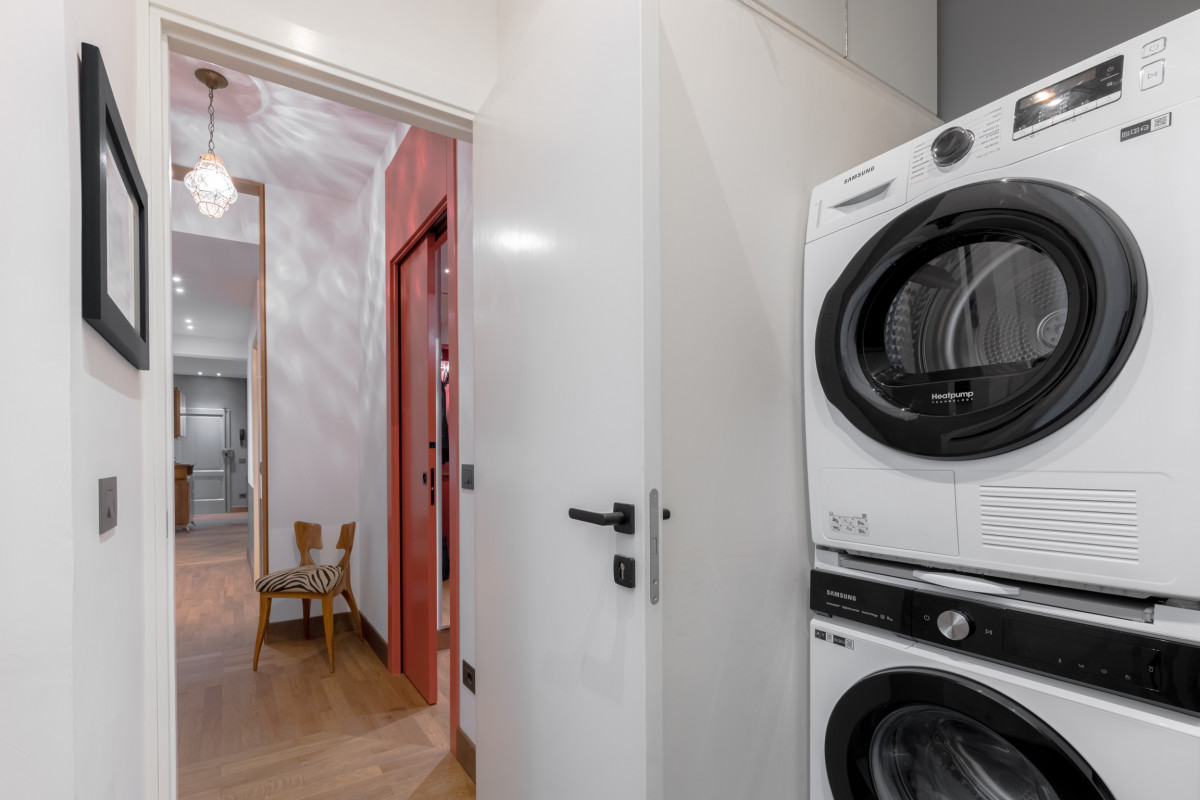 Laundry area with washing machine and storage