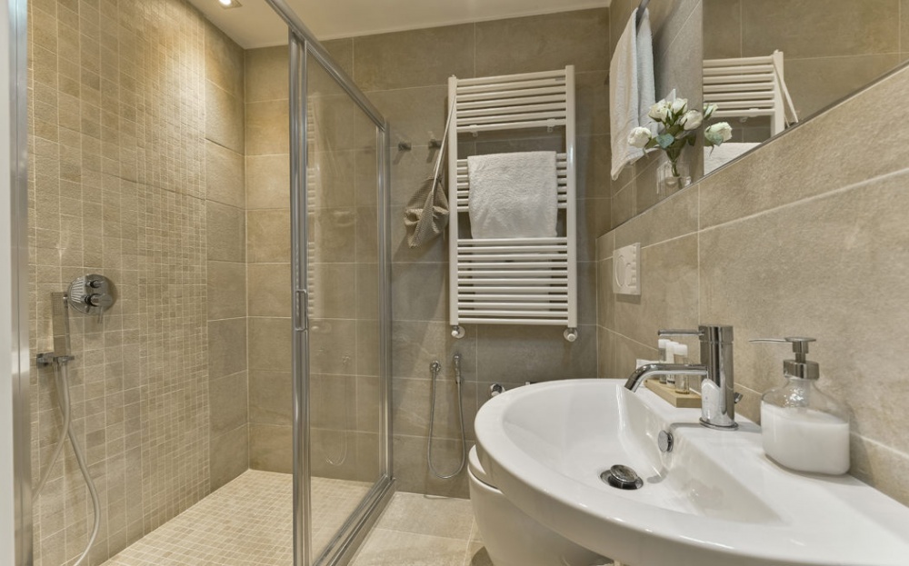 bathroom with glass shower in Florence apartment