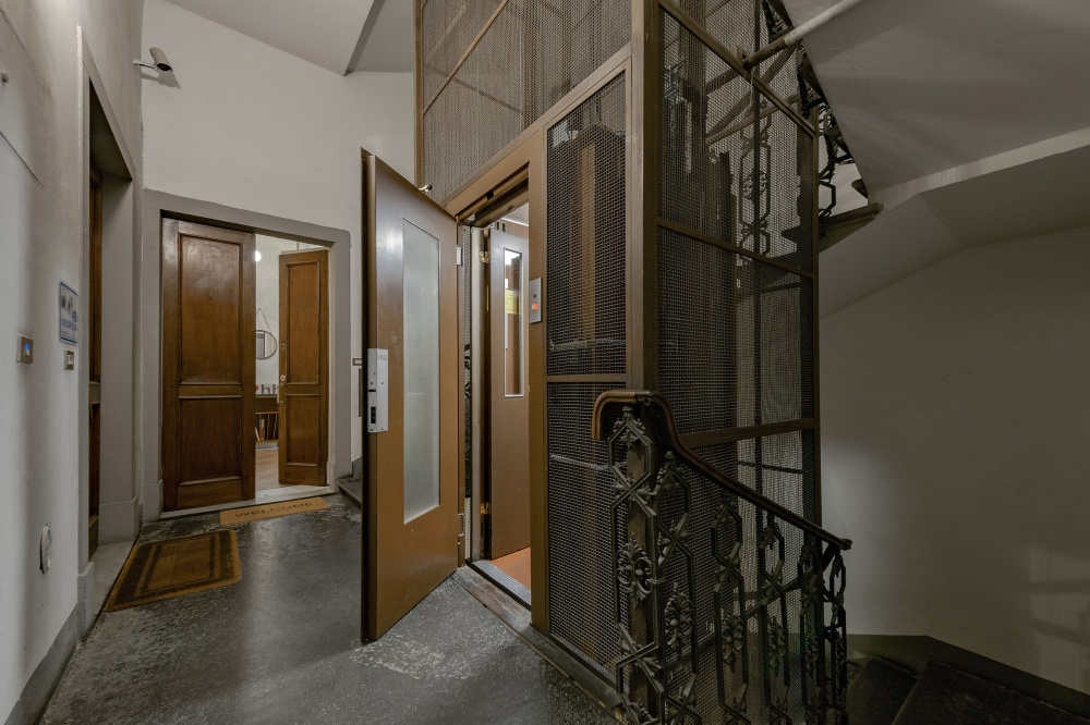 Historic building entrance and staircase of Pitti Historical Home Florence