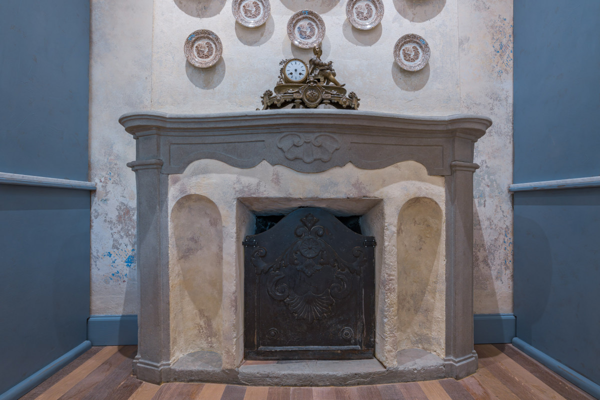 Historic stone fireplace in Florence luxury apartment