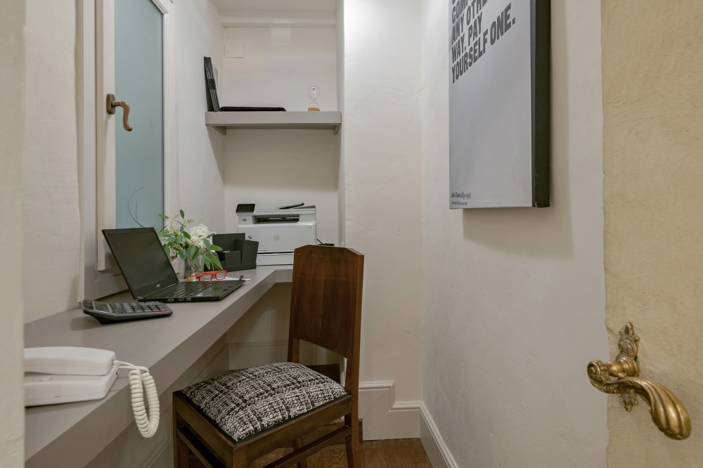 Home office area with desk and printer in Florence luxury apartment