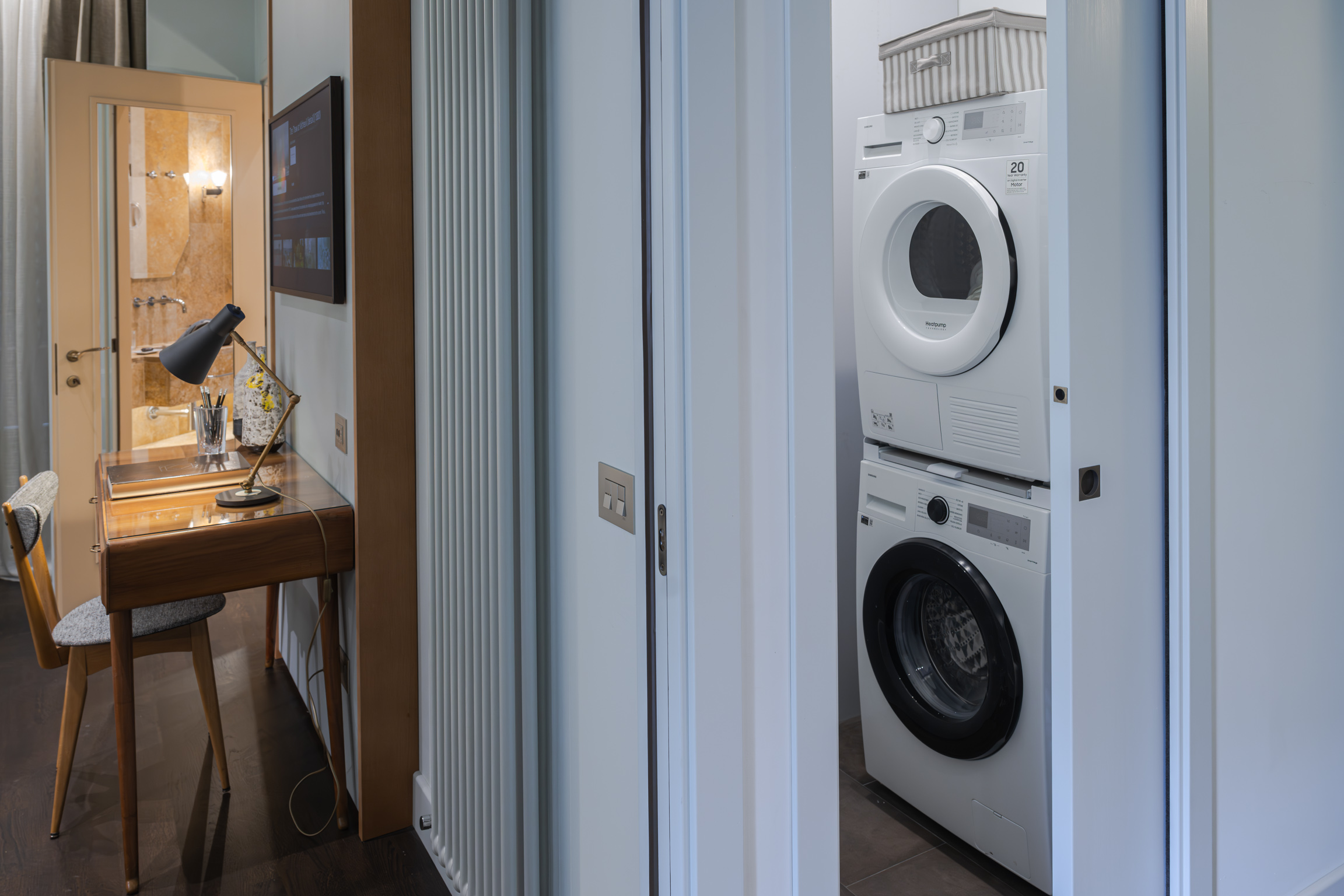 Laundry area with washing machine in Florence apartment